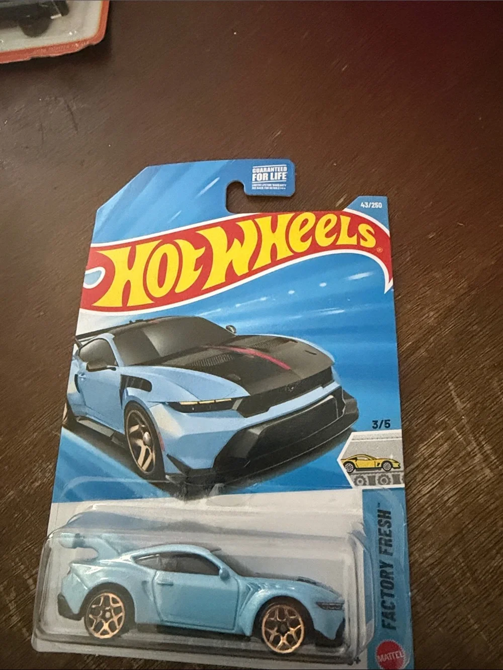 Hot Wheels Light Blue Sports Coupe with Black Hood Accent
